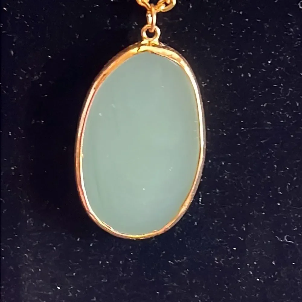Handcrafted green glass pendant on 24 inch gold tone chain